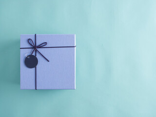 Gifts box on light blue background.