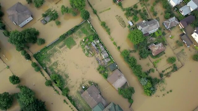 Flooded neighborhood street. Major flooding leaves city, underwater, entire community. Homes, houses overflowing water, insurance needed. Rescue teams helping people Ivano-frankivsk Galych, Ukraine