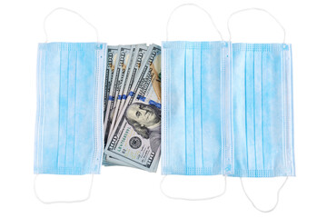 Blue medical face masks and stack of 100 USD banknotes. Isolated on white.