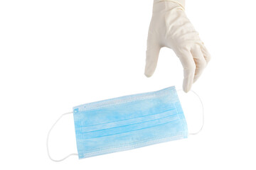 Hand in sterile rubber glove and blue medical face mask isolated on white background.