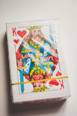 A deck of new cards in a package on a white table. Top view.