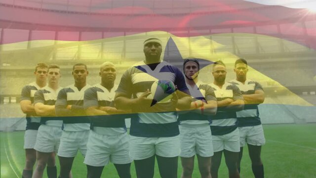 Animation of Ghanaian flag waving over multi-ethnic rugby team standing in a row