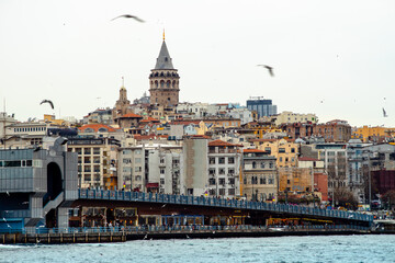 Obraz na płótnie Canvas Istanbul - Turkey - 01/24/2019: Galata which is the former name of the Karaköy neighborhood is visited by thousands of tourists every day for the Tower and the Bridge with the same name.
