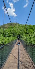 Fototapeta na wymiar Photo session Freedom. Girl on the bridge. Pasarel Dam, Bulgaria.