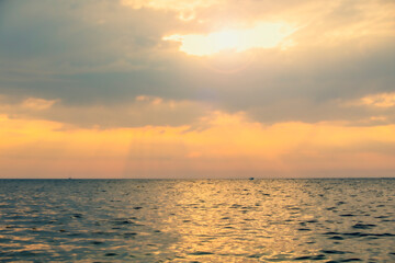 Morning sunrise from the beach over the ocean. Closed sunset