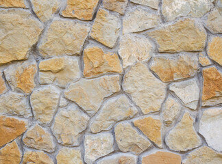 Yellow stone. Natural cobblestone, high detail background, stone background.