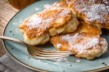 Homemade pancakes on a wooden table.