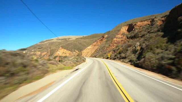 Back view driving in Big Sur California Highway nr 1
