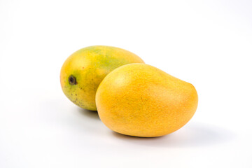 Ripe mango on white background. Tropical fruit. Group of fresh mango. Ripe yellow mangoes