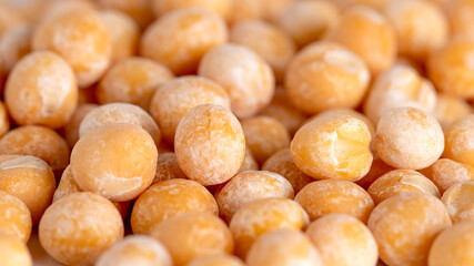Close up of dry yellow peas background, diet food