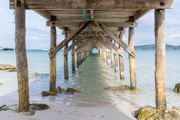 old wooden pier,Saracen bay beach, Koh Rong Samloem island, Sihanoukville, Cambodia.