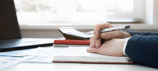 Cropped view of businessman works with financial papers at the table. Finance concept