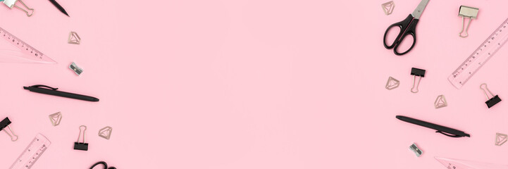 Banner with black office supplies on a  pink pastel background. Creative layout with place for text.