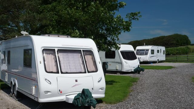 4K: Touring Caravans on a Trailer Park Camp site in the summer. Holiday Vacation. Stock 4K Video Clip Footage