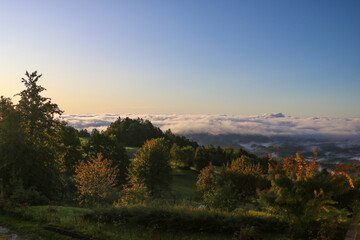 View of a foggy autumn morning in the mountains.