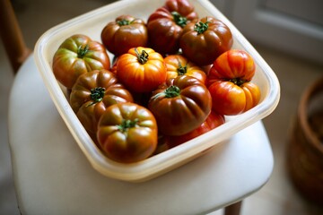 Close-up view of fresh tomatoes. Organic tomatoes grown in the village and standing in the basket. 