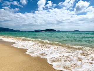 Birch water on the beach of Hainan Island. The clear water of the ocean. South China Sea. Recreation. Landscape.