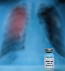 Vaccine from coronavirus or covid-19 , 2019-ncov global outbreak on the background of lung x-ray photo. Pneumonia medication concept, coronavirus vaccine, curing diseases, protecting.