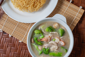 Thai favorite food. Fried noodle with pork and kale soaked in gravy.