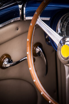 Wooden steering wheel of an old classic car