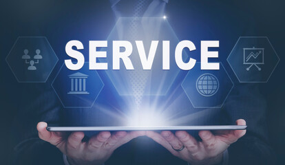 Businessman holding a computer tablet display projecting a Service concept.
