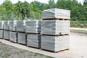 Lot of pallets with bloks for road street works