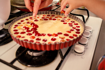 cooking and baking cherry pie with almond slices