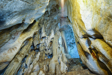 Natural rock cave Light up the path and hallway Wat Tham Khao Pun Kanchanaburi province of Thailand