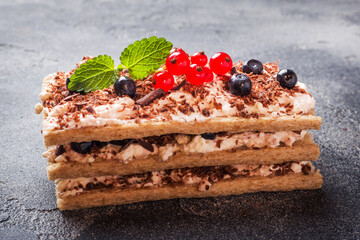 Cottage cheese dessert of crispy dietary bread, curd and blueberries with red currants. Selective focus.