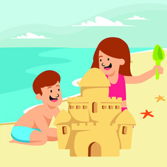 Boy and girl are making sand castle together at the beach