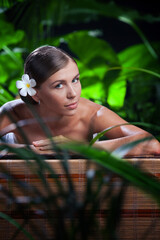 portrait of young beautiful woman in spa environment.  