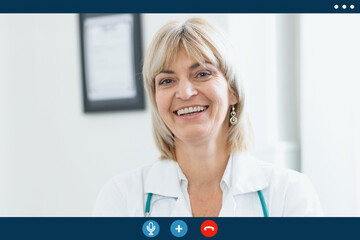 Video call screen of smiling middle age doctor