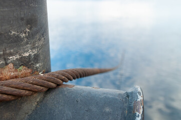 the steel cable goes into the water from the mooring Bollard