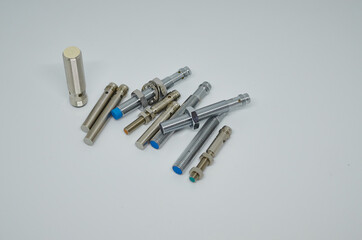 Many Inductive proximity sensor or proximity switch on a white background.