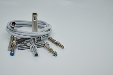 Many Inductive proximity sensor or proximity switch on a white background.