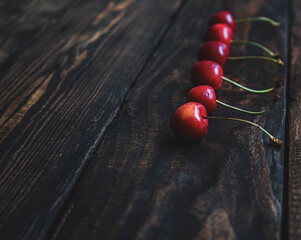 creative background of cherries on wooden background