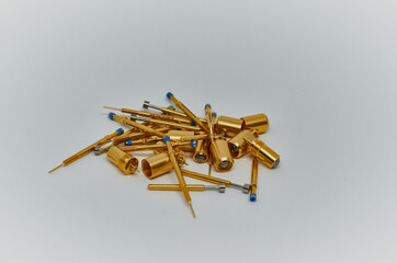 Potentiometers stand on the gray background. Many Potentiometers. Macro close up of electronic...