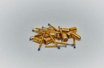 Potentiometers stand on the gray background. Many Potentiometers. Macro close up of electronic...