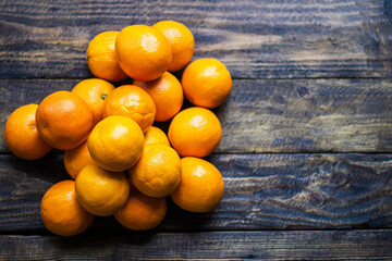many oranges on wooden background