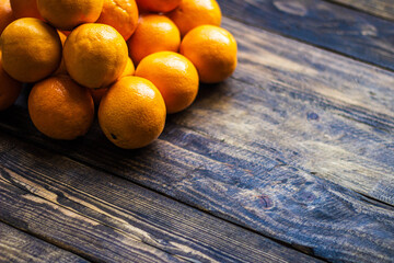 many oranges on wooden background