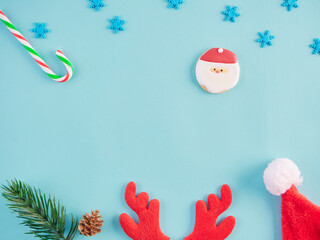 Christmas decorations on light blue background.