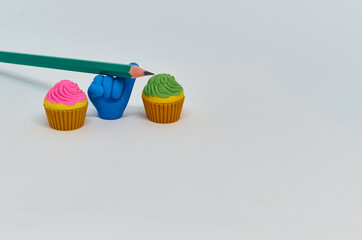 Pencil with pencil shavings and sharpener with eraser