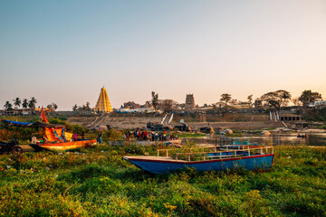 Tungabhadra River and ancient temples at sunset in Hampi, India