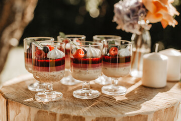 Delicious wedding reception candy bar dessert table on the garden