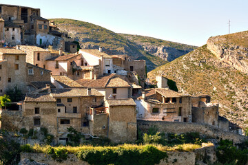 During sunny warm day view to the old obsolete rural houses of Bocairent hillside village placed in north west of Mariola mountain. Vall d'Albaida in Valencian Community, Espana, Spain