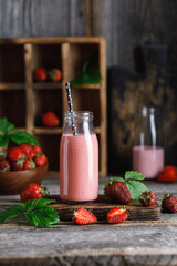 Strawberry milkshake in the glass jar.  Strawberry smoothie, healthy food for breakfast and snack