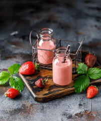 Strawberry milkshake in the glass jar.  Strawberry smoothie, healthy food for breakfast and snack