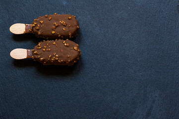 Chocolate and almond ice cream on black background
