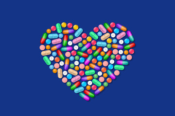 Heart symbol composed from many various colorful tablets and pills