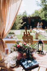 Wedding flowers on the banquet table. Table decoration.